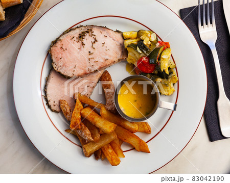 Pork loin with french fries and vegetables 83042190