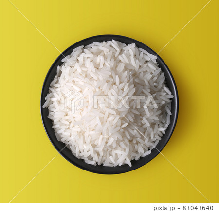 rice in a bowl on yellow 83043640