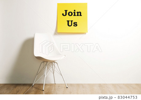 Head hunting help wanted poster concept. Minimalistic composition with chair and blank copy space wall. Head hunting help wanted poster concept. Minimalistic composition with chair and blank copy space wall. 83044753