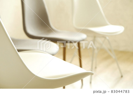 Empty chairs. Vacant job position concept. Minimlistic interior lofty room with elegant furniture pieces. Empty chairs. Vacant job position concept. Minimlistic interior lofty room with elegant furniture pieces. 83044783