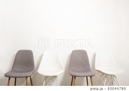 Empty chairs. Vacant job position concept. Minimlistic interior lofty room with elegant furniture pieces. Empty chairs. Vacant job position concept. Minimlistic interior lofty room with elegant furniture pieces. 83044789