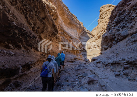 Hiking in a slot canyon of Lake Mead Hiking in a slot canyon of Lake Mead 83046353
