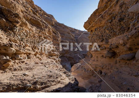Hiking in a slot canyon of Lake Mead 83046354