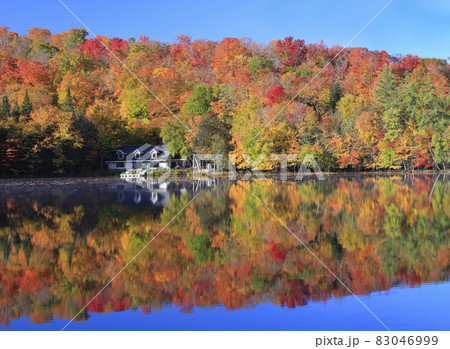 Autumn leaf color reflected on the lake in Mont Tremblant area, Quebec, Canada Autumn leaf color reflected on the lake in Mont Tremblant area, Quebec, Canada 83046999