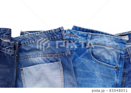 Blue jeans denim with pocket isolated at white background. Jeans heap 83048051