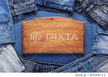 Blue jeans denim and sign wood name plate. Jeans with wooden nameplate background texture 83048123