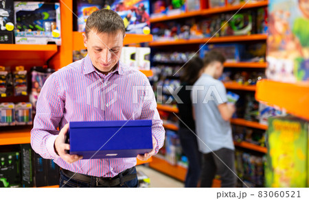 Man buying toys in store 83060521