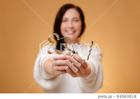 Metal molds for baking cookies in blurred woman's hands. 83063618