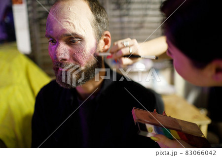 Zombie male makeup for halloween concept. Blood on skin face Zombie male makeup for halloween concept. Blood on skin face 83066042