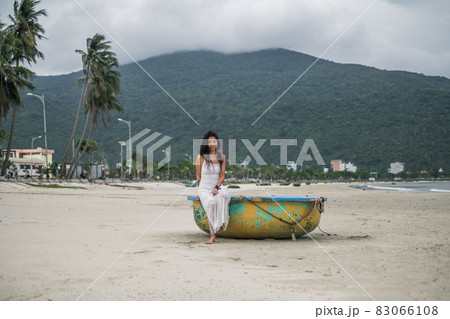 Black long curly hair. Looking at camera with copy space and smiling. Romantic photo. Mountain view. High quality photo Black long curly hair. Looking at camera with copy space and smiling. Romantic photo. Mountain view. High quality photo 83066108