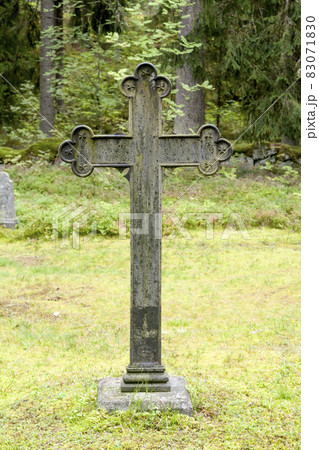 Cross at old beautiful semetery in Finland. 83071830