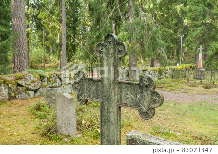 Cross at old beautiful semetery in Finland. 83071847