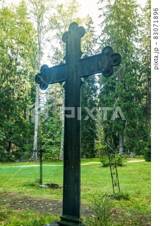 Cross at old beautiful semetery in Finland. 83071896