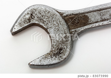 old wrench on white background 83073990