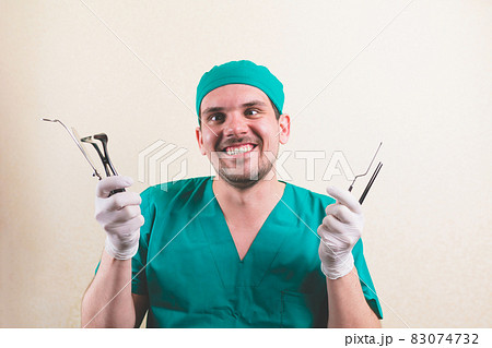 Young doctor with medical instruments Young doctor with medical instruments 83074732