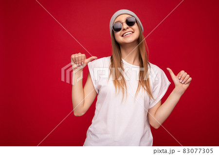 Photo of cute nice winsome positive adult woman wearing casual outfit isolated on background wall Photo of cute nice winsome positive adult woman wearing casual outfit isolated on background wall 83077305