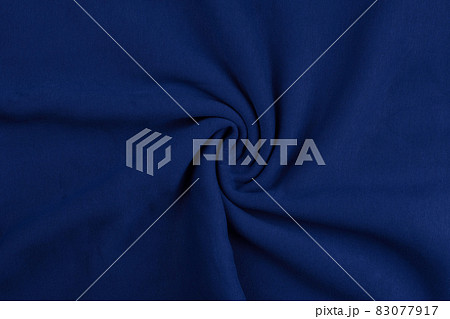 Background from blue monochrome cotton fabric. Close up texture 83077917