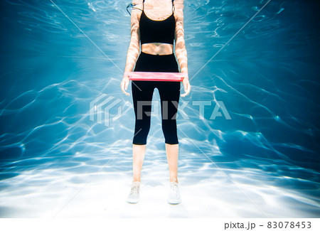 Running woman jogging. Girl under water, freshness and lightness, fitness and swimming. Sports and lifestyle Running woman jogging. Girl under water, freshness and lightness, fitness and swimming. Sports and lifestyle 83078453