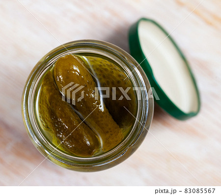 Glass jar of pickled cucumbers Glass jar of pickled cucumbers 83085567
