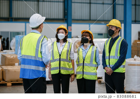 Engineer in uniform wear protection mask brainstorming workshop industrial factory building. Engineer in uniform wear protection mask brainstorming workshop industrial factory building. 83088681