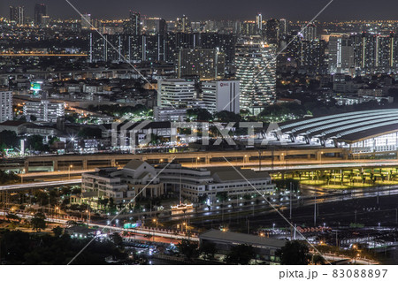 Aerial view of Bang Sue central station with skyscrapers background at night. Aerial view of Bang Sue central station with skyscrapers background at night. 83088897