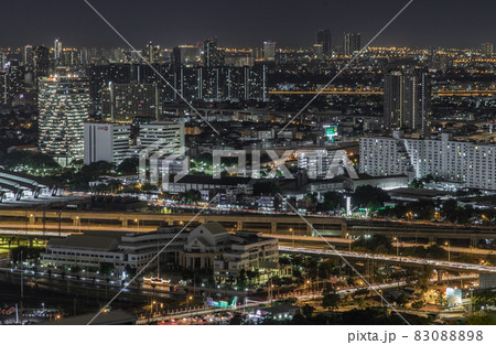 Aerial view of Bang Sue central station with skyscrapers background at night. 83088898