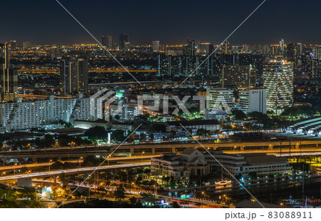 Aerial view of Bang Sue central station with skyscrapers background at night. Aerial view of Bang Sue central station with skyscrapers background at night. 83088911