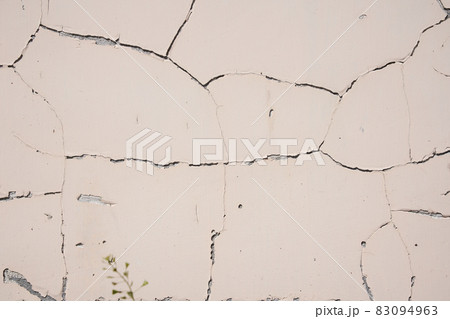 Overlay for your design. Background texture of a white cement wall with a crack. A crack in the old wall. High quality photo 83094963