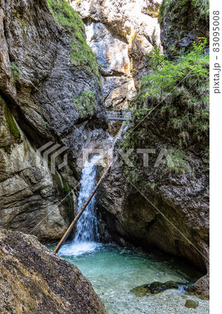 The wild-romantic Almbachklamm in the Berchtesgaden Land is a popular excursion destination in Bavaria, Germany 83095008