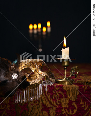 candlestick and Venetian mask 83095400
