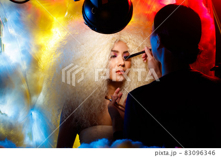 Behind the scene of make up artist of Half Body Portrait of 20s Asian beautiful Woman blonde afro 83096346