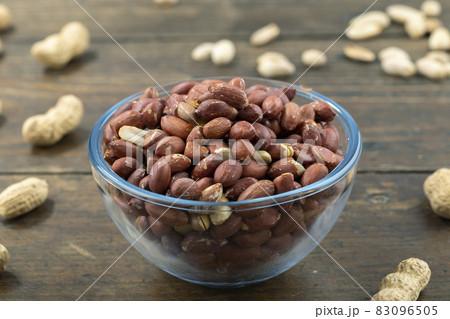 Peanuts in their husks in a glass bowl Peanuts in their husks in a glass bowl 83096505