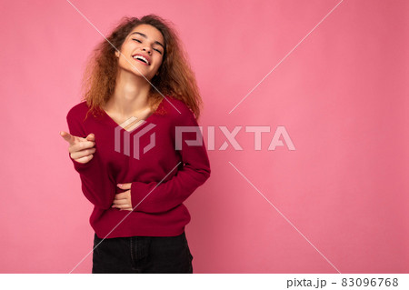 Photo of young european happy joyful laughing positive charming cute brunette curly woman with 83096768