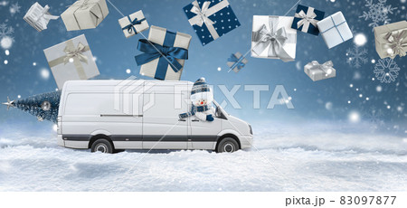 Delivery van driven by a snowman carries christmas presents 83097877