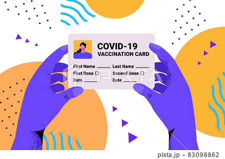 hands holding covid-19 vaccination record card global immunity passport risk free re-infection pcr certificate hands holding covid-19 vaccination record card global immunity passport risk free re-infection pcr certificate 83098862