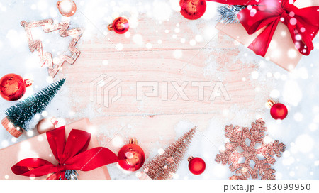 Christmas wood snow. Xmas board with old rustic wall, white frozen snowflake, golden balls and gift box. Winter wooden decoration background. Happy new year copy space. Christmas wood snow. Xmas board with old rustic wall, white frozen snowflake, golden balls and gift box. Winter wooden decoration background. Happy new year copy space. 83099950