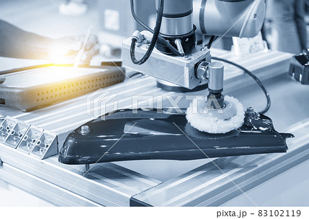 The engineer input the program to robotic arm polishing the automotive painting parts. The engineer input the program to robotic arm polishing the automotive painting parts. 83102119