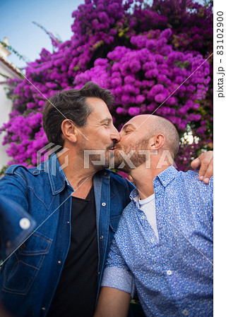 Happy gay couple taking selfie on romantic trip Happy gay couple taking selfie on romantic trip 83102900
