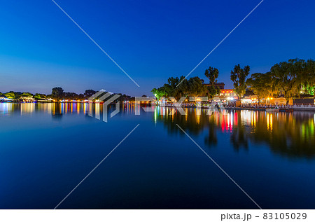 Peaceful reflection of the evening blue hour in Shichahai lake in Beijing 83105029