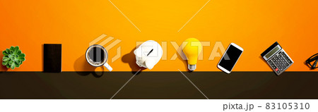 Office supplies with a piggy bank and a lightbulb 83105310