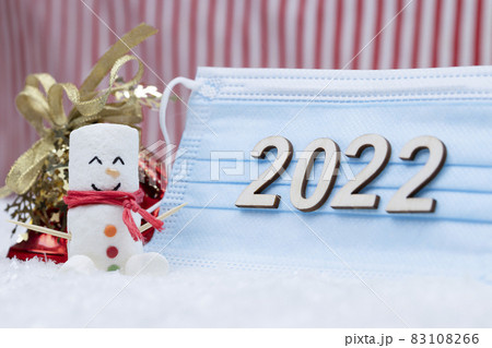 New Year and Merry Christmas 2022. Snowman from marshmallows. New Year theme. New Year and Merry Christmas 2022. Snowman from marshmallows. New Year theme. 83108266