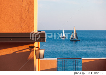 two sailboats in mediterranean sea 83108495