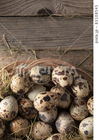 Quail eggs on an old wooden table. 83108545