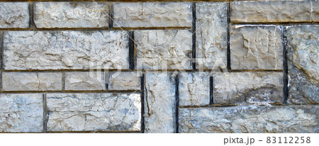 Sturdy blue and gray cut stone wall, seamless lined up Sturdy blue and gray cut stone wall, seamless lined up 83112258
