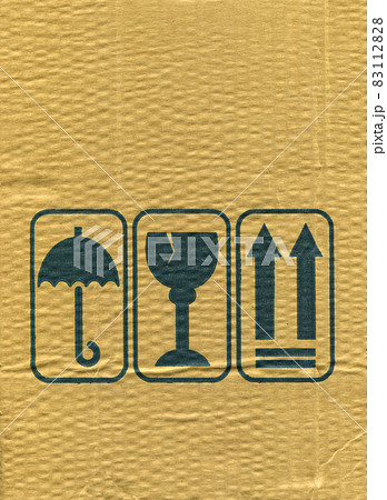 Brown and beige corrugated cardboard and warning signs detail 83112828