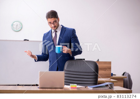 Young handsome employer in teleconference concept 83113274