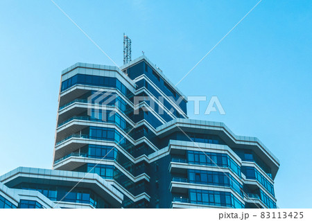 Modern urban architecture with glass windows exterior of the building with offices facade 83113425