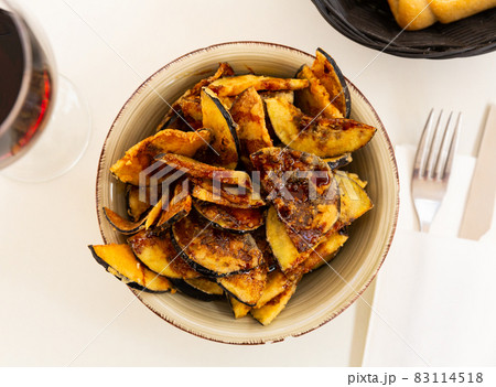 Fried eggplant with honey, classic Andalusian dish Fried eggplant with honey, classic Andalusian dish 83114518
