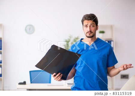Young male doctor radiologist working in the clinic 83115319