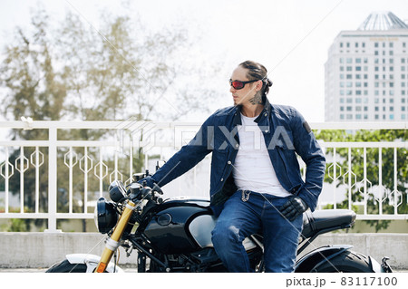 Stylish Man on Motorcycle Stylish Man on Motorcycle 83117100